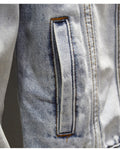 Close-up of a hand pocket on the light-wash denim