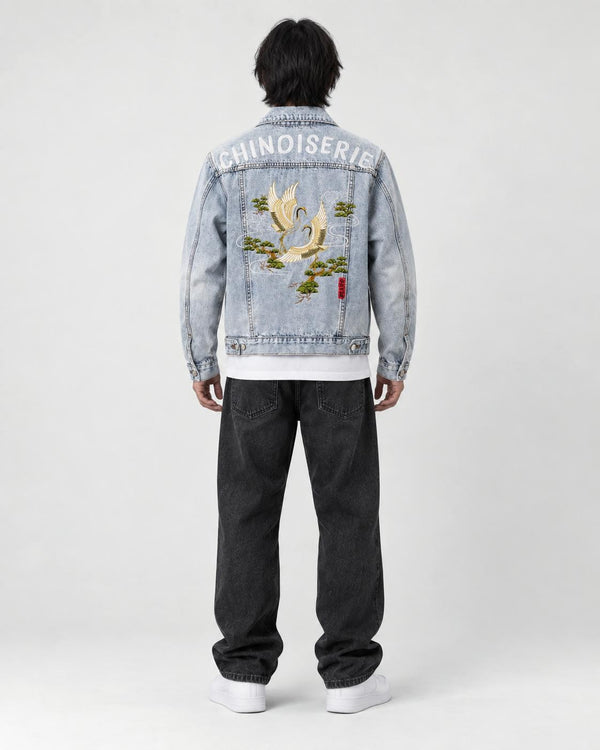 Model wearing the crane embroidered denim jacket, back view