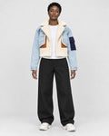 Model wearing the light blue cropped fleece panel jacket, front view