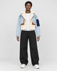 Model wearing the light blue cropped fleece panel jacket, front view