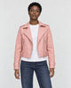 Model wearing the pink cropped moto jacket open over a white tee, front view