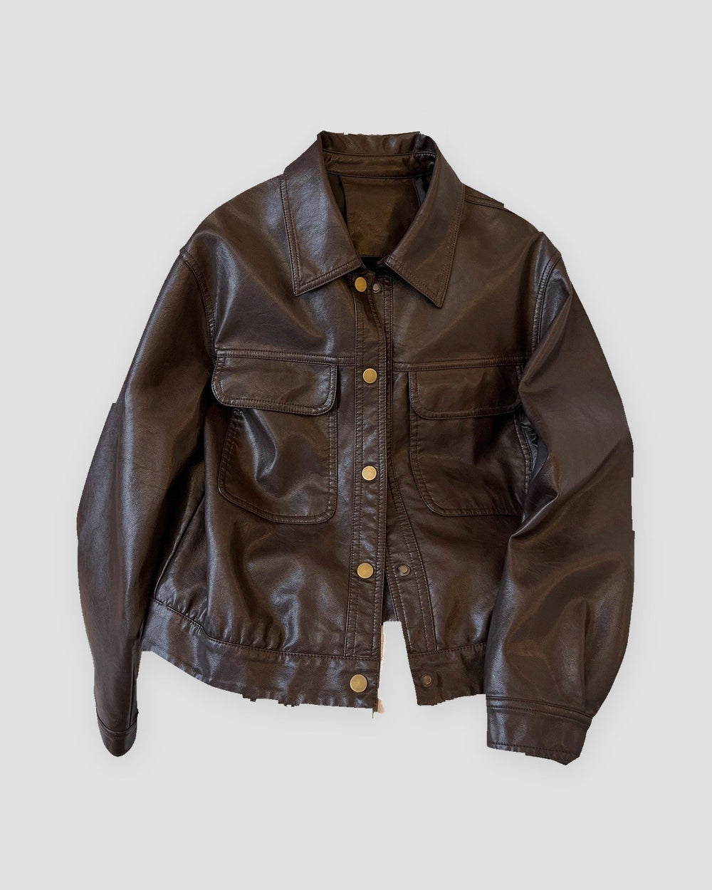 Deep brown cropped PU leather jacket with flap pockets and gold snaps, front view