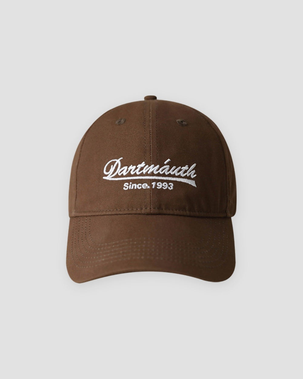 Brown dad cap with white cursive script embroidery, front view