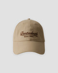 Khaki dad cap with brown cursive script embroidery, front view