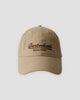 Khaki dad cap with brown cursive script embroidery, front view