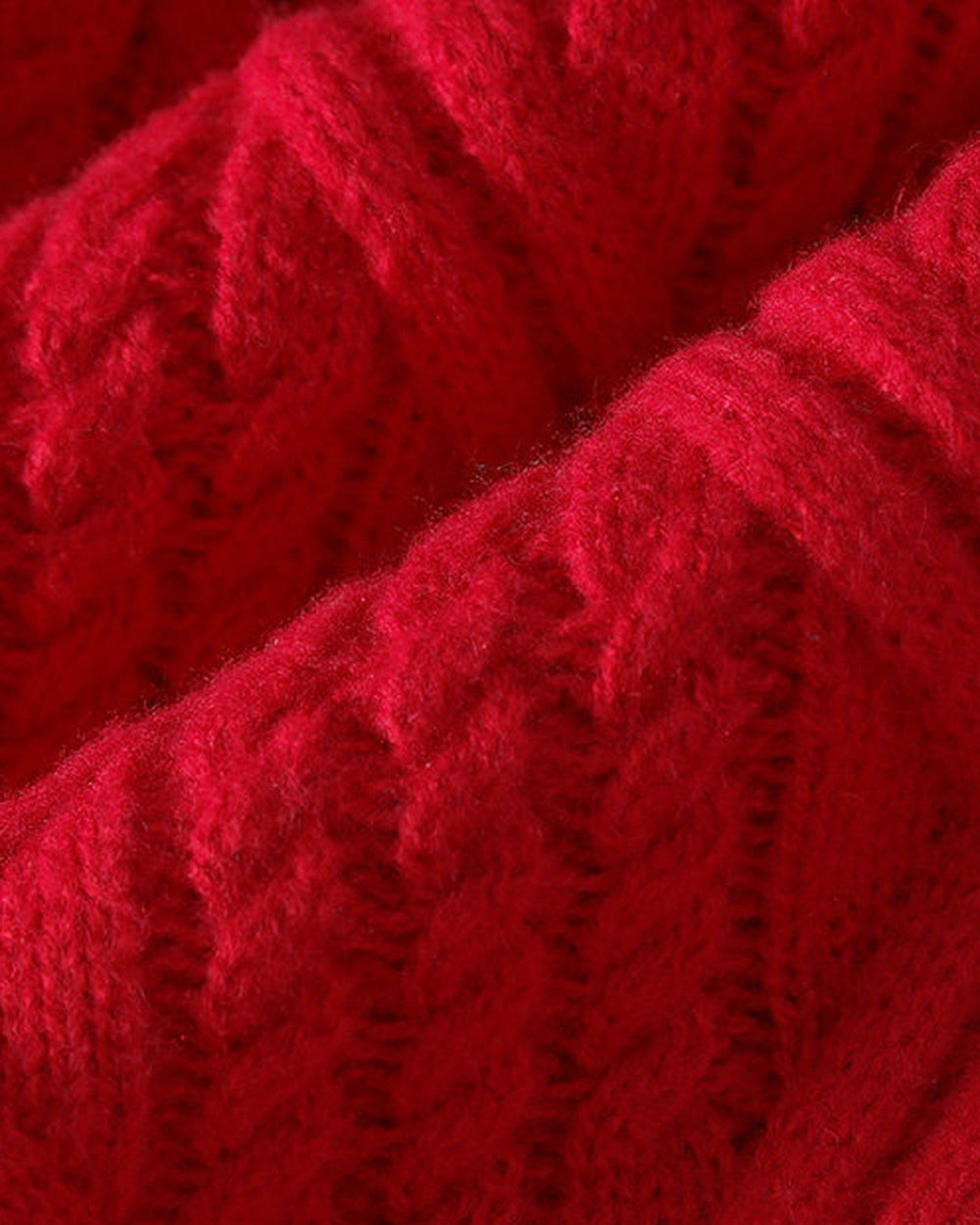 Close-up of the red diamond cable knit