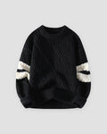 Black diamond cable knit sweater with cream sleeve stripes