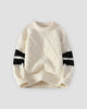 Cream diamond cable knit sweater with black sleeve stripes