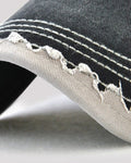 Close-up of the zigzag frayed brim edge and rows of stitching