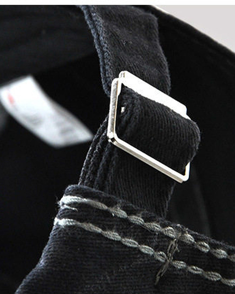 Close-up of the adjustable back strap and metal buckle