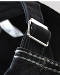 Close-up of the adjustable back strap and metal buckle
