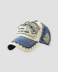 Denim blue distressed patch cap, three-quarter view, gold emblem on the side