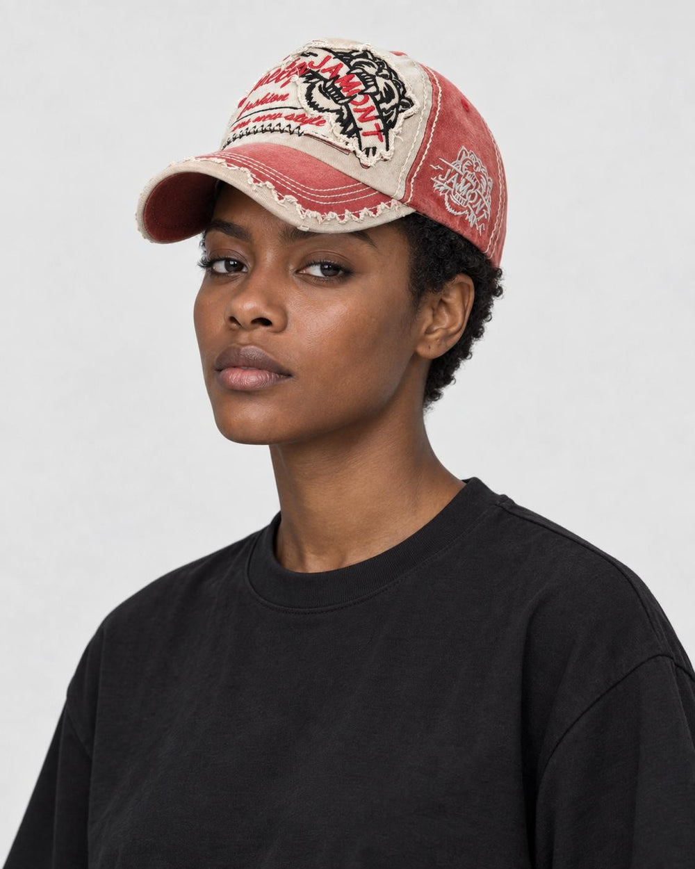 Model wearing the washed red distressed patch cap, three-quarter view