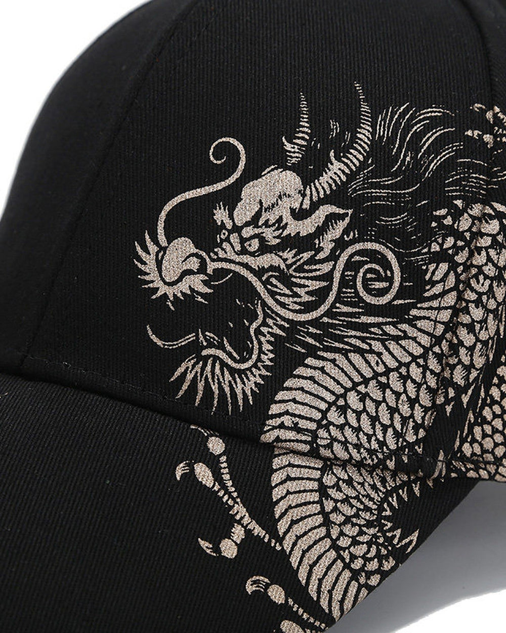 Close view of the dragon's head printed in metallic silver ink on black cotton twill