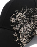 Close view of the dragon's head printed in metallic silver ink on black cotton twill