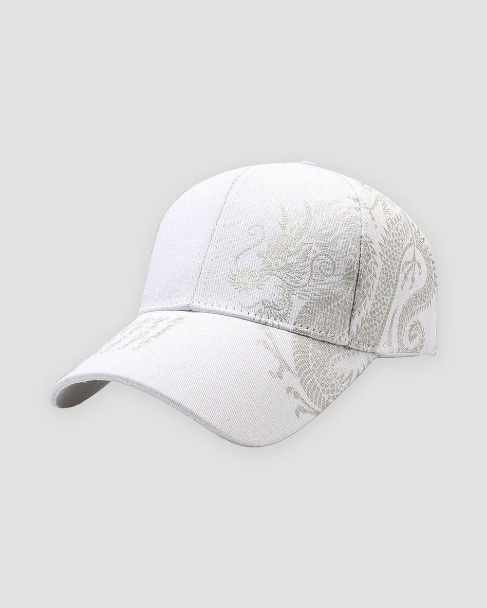 White baseball cap with a pale taupe dragon printed across the side and calligraphy on the brim