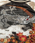 Close-up of the embroidered dragon head, clouds and red peonies