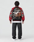 Model wearing the black and red dragon bomber, back view of the embroidery
