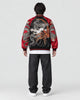Model wearing the black and red dragon bomber, back view of the embroidery