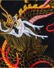 Close-up of the dragon's head embroidered in gold, red and white thread