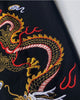 Close-up of the gold and red dragon embroidered on the leg
