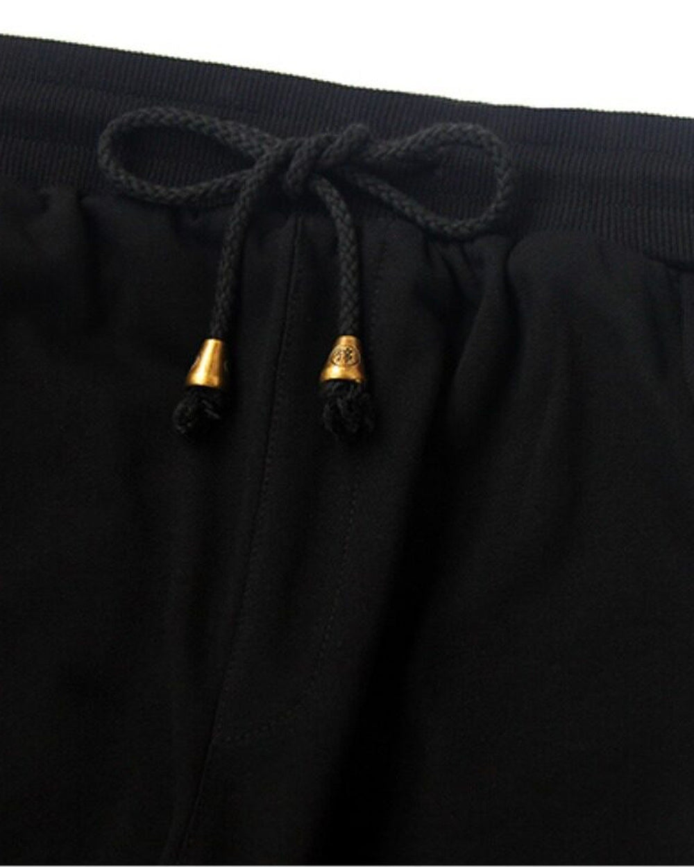 Close-up of the elastic waist and the drawcord with gold metal tips