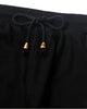 Close-up of the elastic waist and the drawcord with gold metal tips