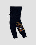 Black jogger pants with a dragon embroidered down one lower leg, front view