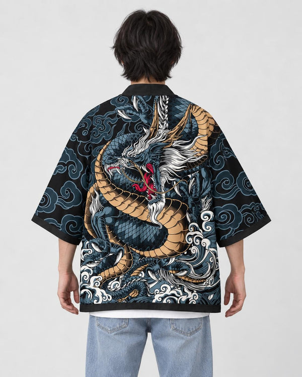Man seen from behind in the black haori with a scaled blue-gray dragon and white waves across the back, over a white tee