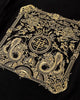 Close-up of the gold dragon seal embroidery on the back