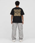 Model wearing the black dragon seal T-shirt, back view of the gold seal panel