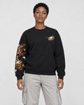 Model wearing the black dragon sleeve sweatshirt with stone trousers, front view