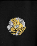 Close-up of the gold and silver wave emblem stitched on the chest
