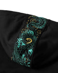 Close-up of the teal and gold dragon embroidery on the hood