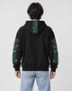 Model wearing the dragon sleeve hoodie, back view of the hood embroidery