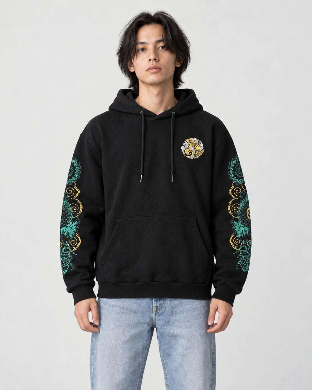 Model wearing the black hoodie with teal and gold dragon sleeves, front view