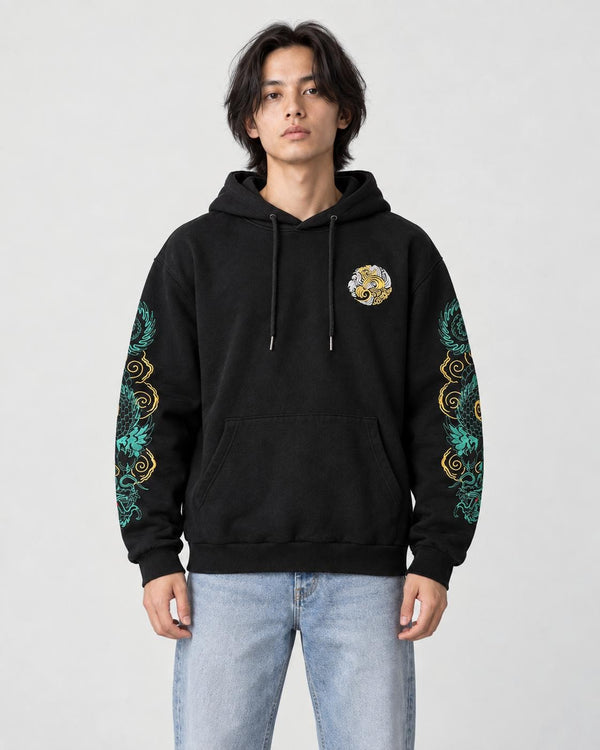 Model wearing the black hoodie with teal and gold dragon sleeves, front view