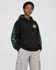 Model wearing the dragon sleeve hoodie with stone cargo trousers, three-quarter view