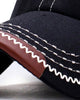 Close-up of the zigzag stitching and tan edge on the brim