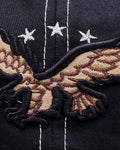 Close-up of the raised embroidered eagle under three white stars