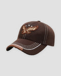 Brown eagle embroidered baseball cap with white topstitching, three-quarter view