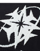 Close-up of the star and ring knitted into the black sweater