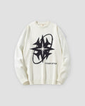 White knit sweater with a large black eight-point star and ring