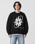 Model wearing the black star knit sweater with jeans, front view