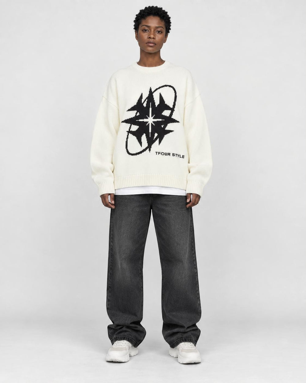 Model wearing the white star knit sweater, front view