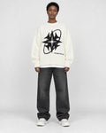 Model wearing the white star knit sweater, front view