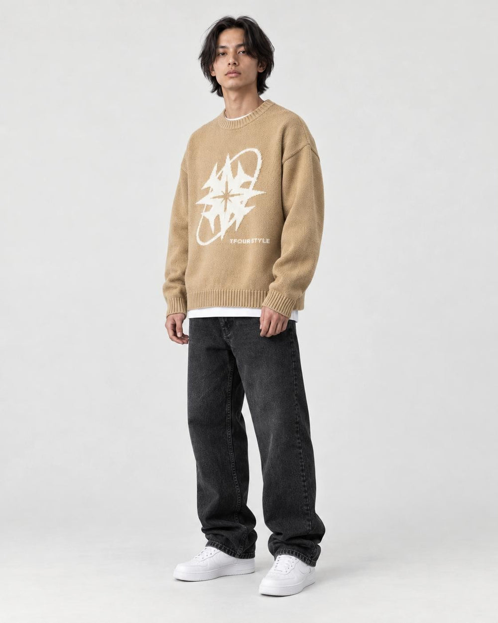 Model wearing the khaki star knit sweater, three-quarter view