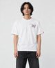 Model wearing the white T-shirt with a small butterfly on the left chest, front view