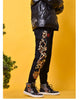 Black joggers worn standing with the pine tree and pavilion embroidery on the outer leg and elastic cuffs