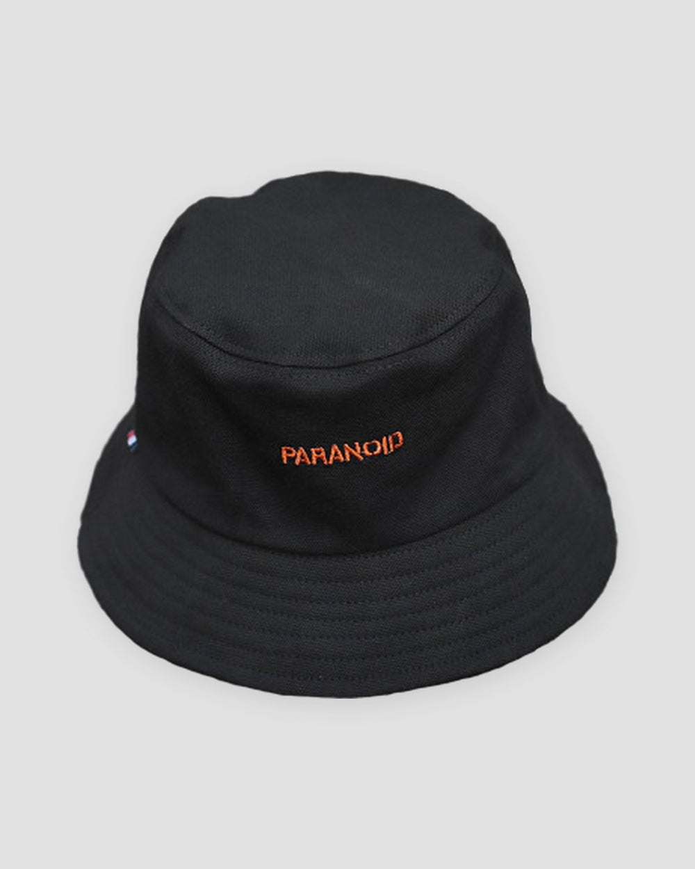Black bucket hat with PARANOID embroidered in orange across the front